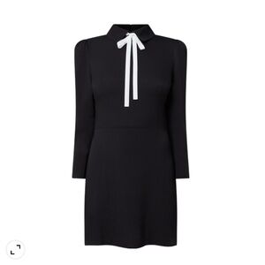 Reformation Rocco black long sleeve cocktail dress with white bow. Size 4